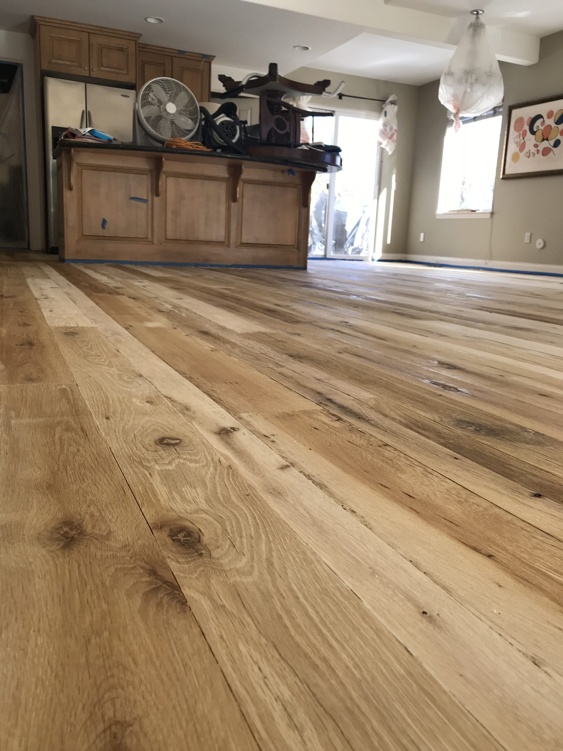 A bleached reclaimed hardwood floor with a light, natural finish.